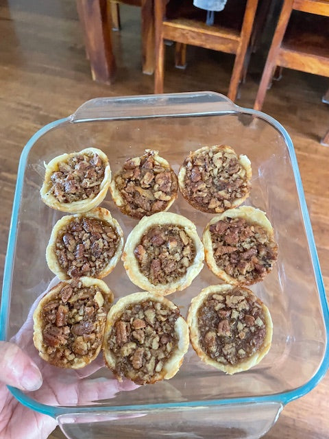 Homemade Canadian maple syrup butter tarts in a glass baking dish, fresh from the oven