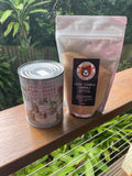 Maple syrup can and granulated maple sugar bundle on timber deck