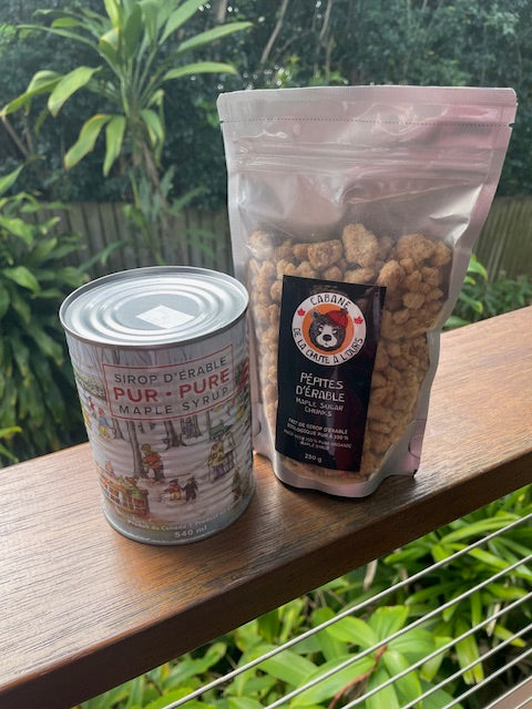 Maple syrup can and maple sugar chunks bundle on timber deck