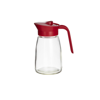 Clear glass carafe with a red lid and handle on a white background